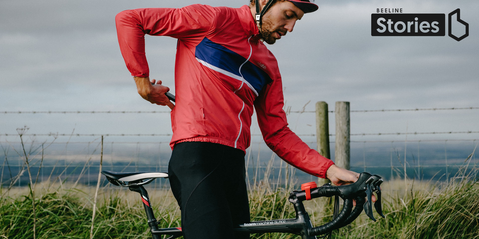 Marc Baldwin putting his phone in his back pocket