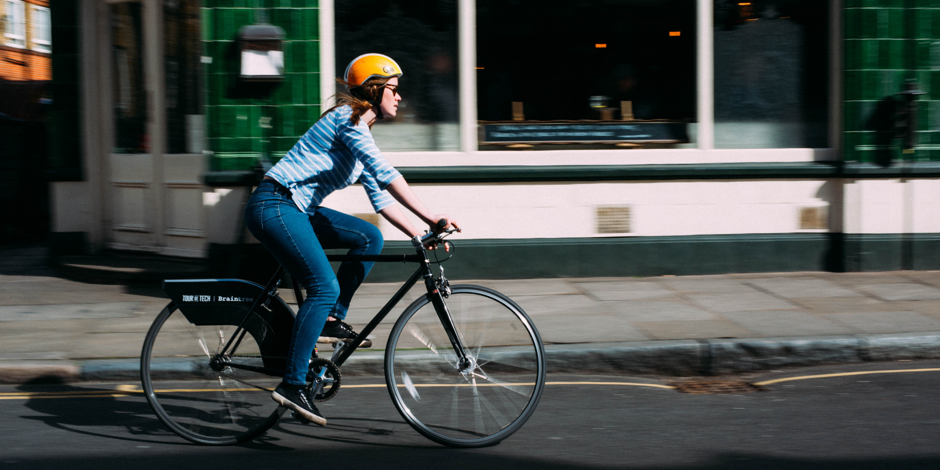 Woman cycling in casual clothing