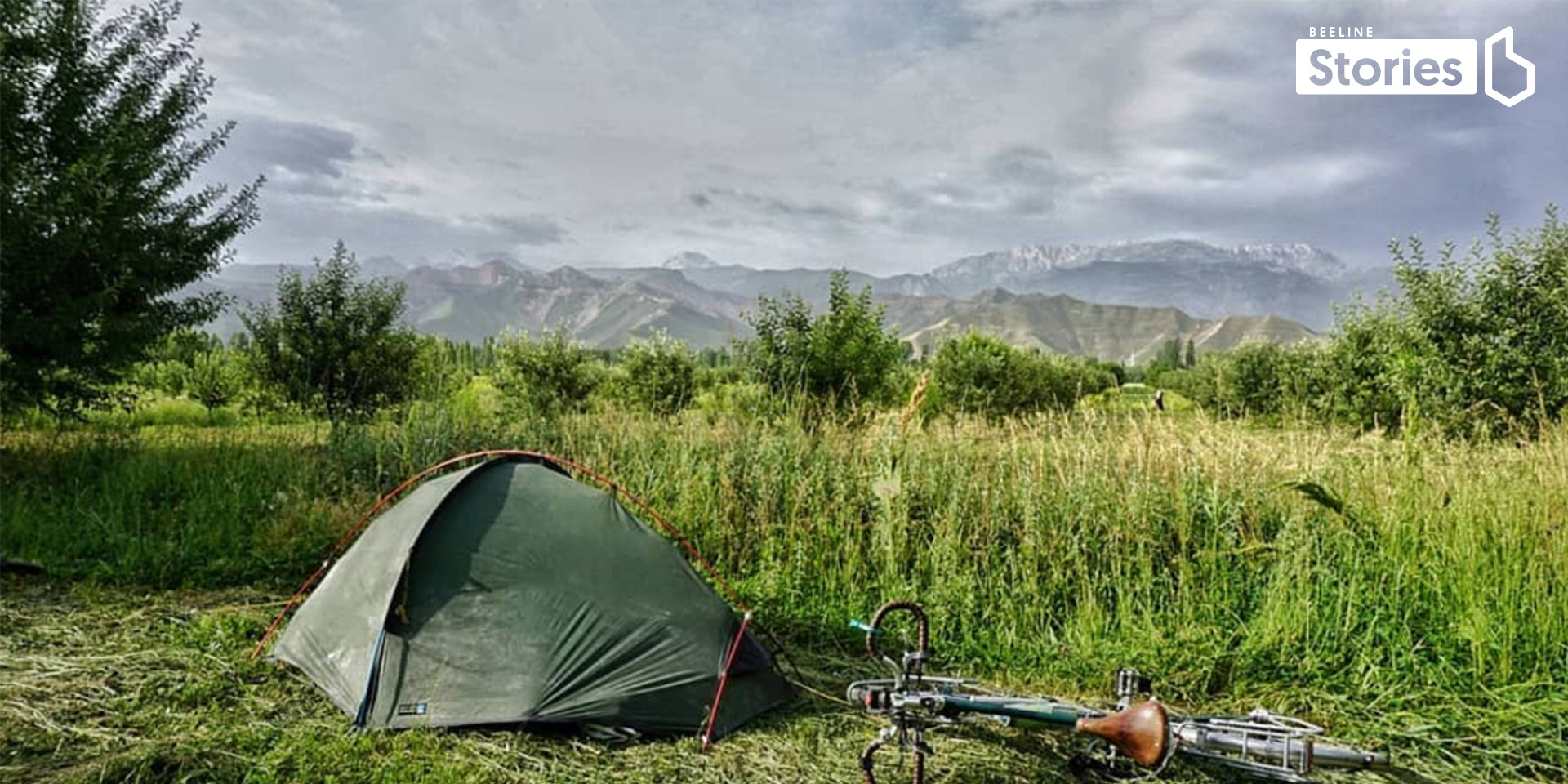 camping in a field on a bike ride in Asia