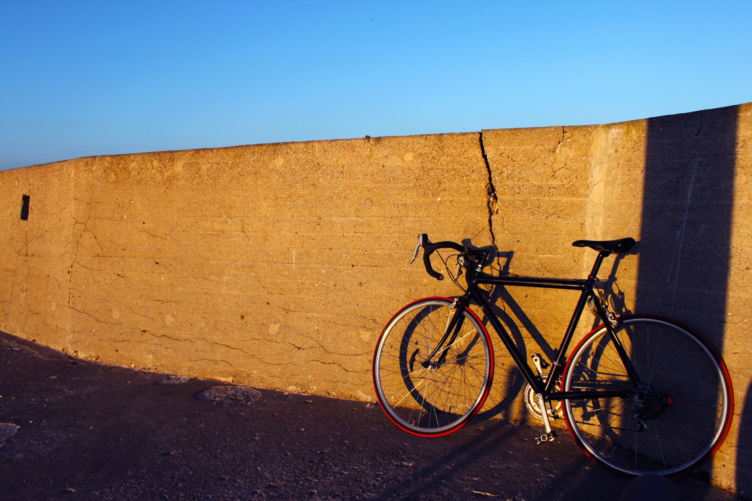 bike against a wall on a sunny day